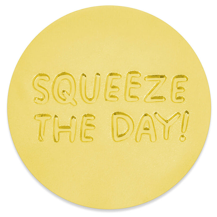 A round yellow sticker with the phrase 'SQUEEZE THE DAY!' embossed in raised letters, shown on a plain white background.