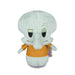 Plush toy of a character with a light green body and orange shirt on a white background
