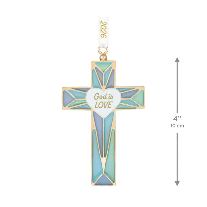 Decorative cross pendant with 'God is Love' message on a white background