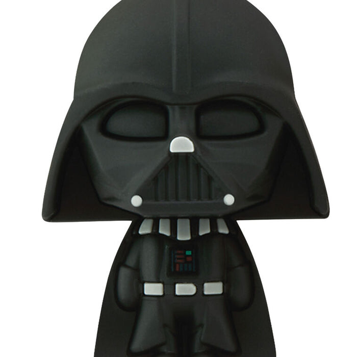 A stylized Darth Vader collectible figure with a glossy black finish and small silver and red details, shown against a plain white background.
