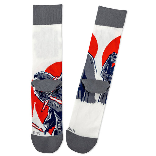 Pair of socks with a design of a character holding a weapon on a white background