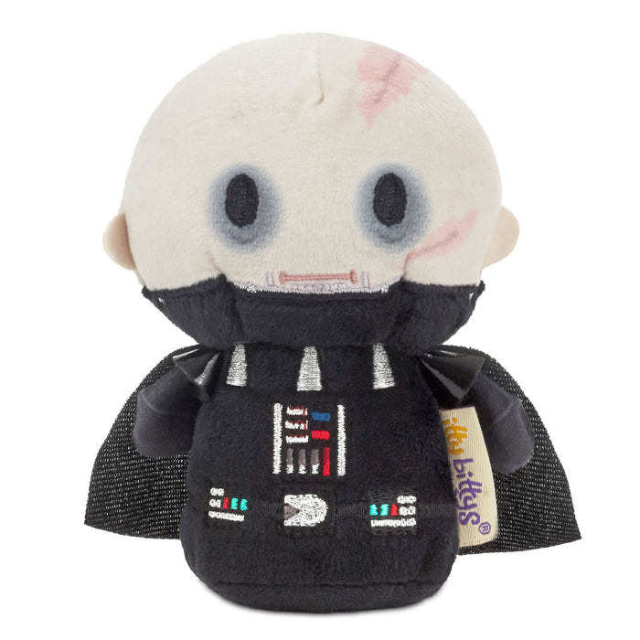 Plush toy resembling a character from 'Star Wars' with a white head and black outfit on a white background