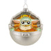 Decorative ornament featuring a character in a silver and gold pod on a white background