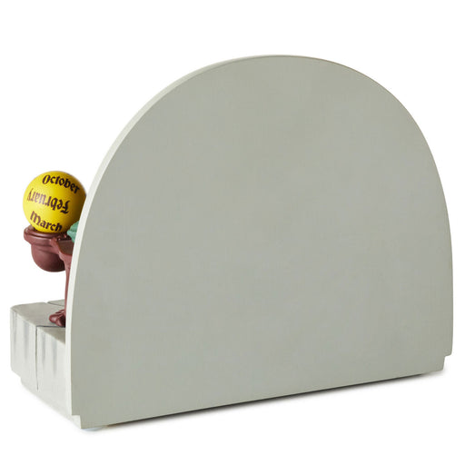 Gray arch-shaped bookend with a small ball on a white background