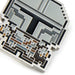 Close-up of a detailed electronic component with intricate patterns on a white background
