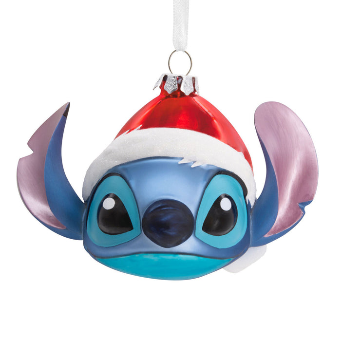 Christmas ornament shaped like a blue character's face with a Santa hat on a white background