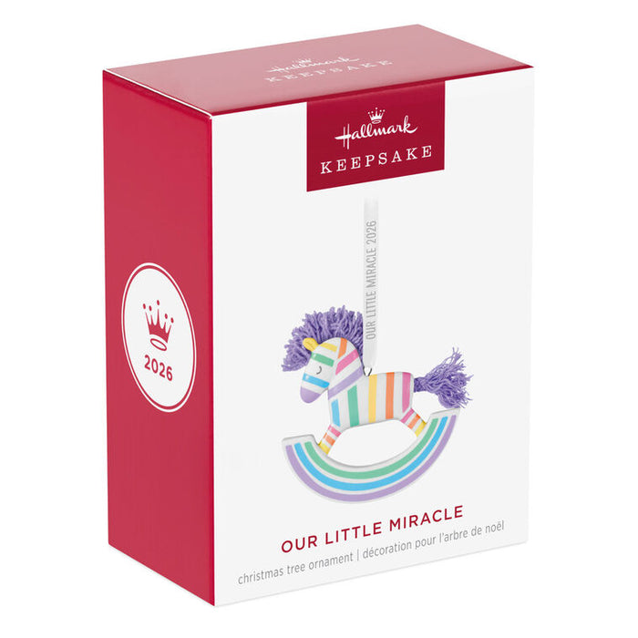 Hallmark 2026 'Our Little Miracle' rainbow rocking horse ornament packaging on a white background