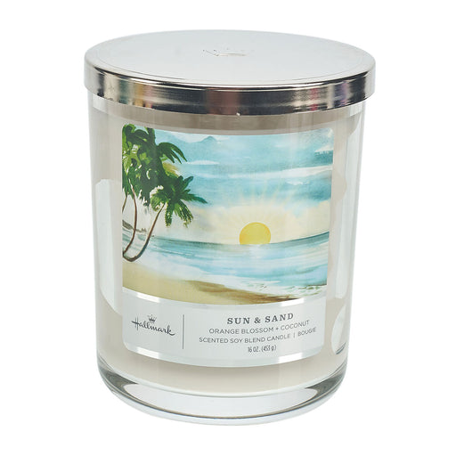 Candle with a beach scene label on a white background