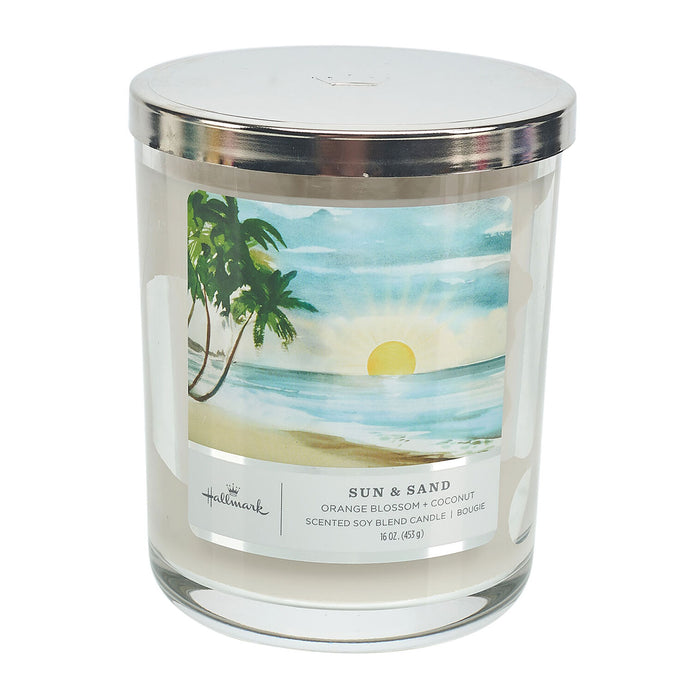 Candle with a beach scene label on a white background