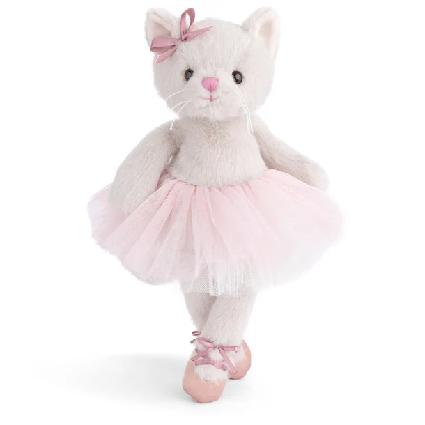 Plush toy cat in a ballerina outfit with a pink bow on a white background
