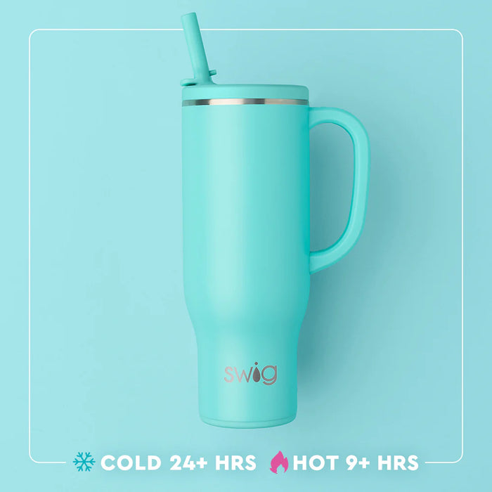 Turquoise mug with handle and straw on a light blue background, featuring the Swig brand.