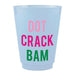 A light blue plastic shot glass featuring the text 'DOT CRACK BAM' in pink, magenta, and green lettering, set against a plain white background.