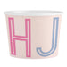 Paper cup with pink and blue letters 'H' and 'J' on a light pink background