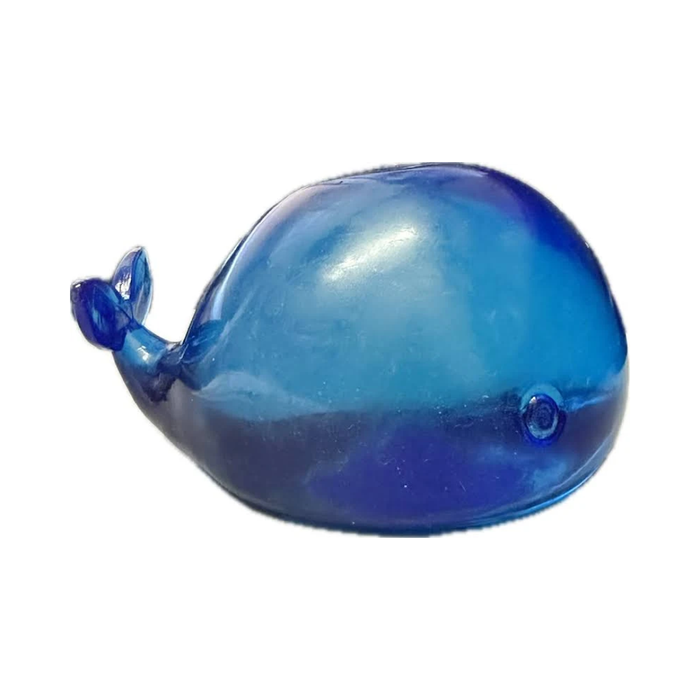 A translucent blue whale-shaped squishy toy on a plain white background.