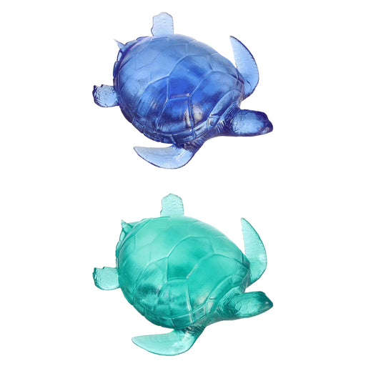 Two transparent blue and green turtle toys on a white background