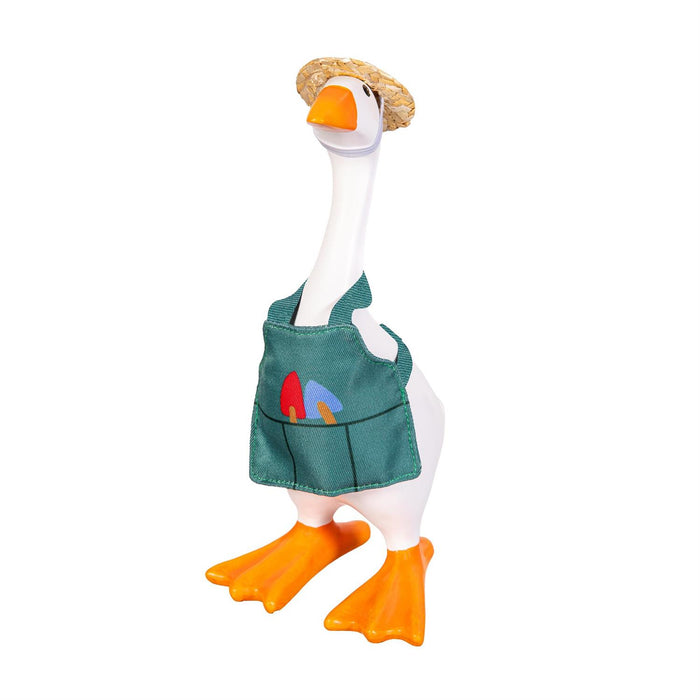 Toy goose with a green apron and straw hat on a white background