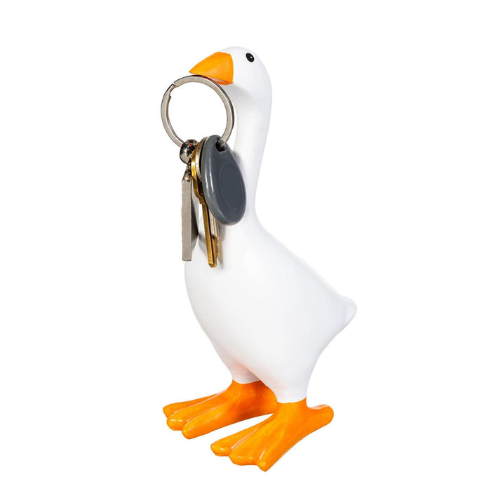 A white goose-shaped key holder with orange beak and feet, holding a metal keyring with keys, on a plain white background.