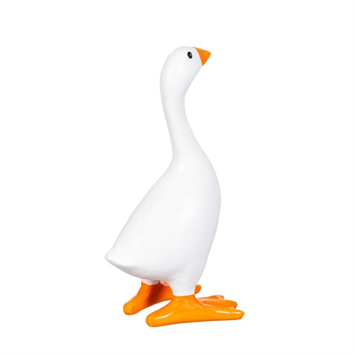 A white goose figurine with bright orange beak, feet, and eye, standing on a plain white background.
