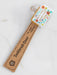 Toothbrush cover with decorative packaging on a white background