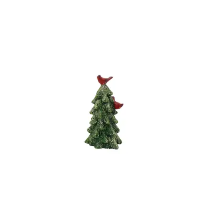 Small decorative Christmas tree with a red bird on top against a white background