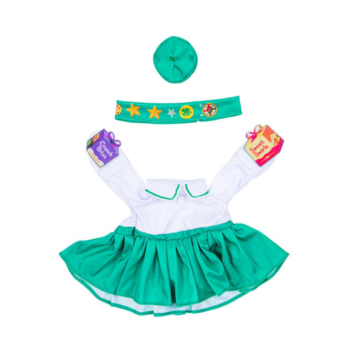 Children's costume set with green dress, white shirt, and accessories on a white background