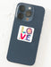 Phone case with a colorful 'LOVE' design on a white background