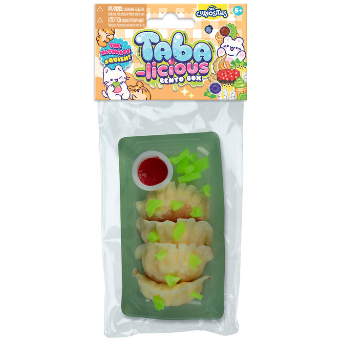 Taba-licious bento box packaging with cartoon characters on a white background