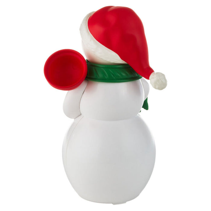 Snowman figurine with a red hat and green scarf on a white background