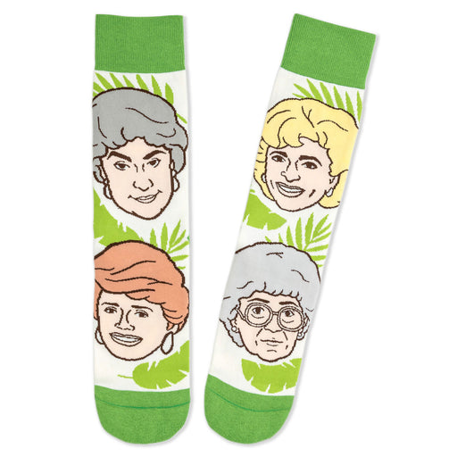 Pair of socks with illustrations of four people's faces on a white background