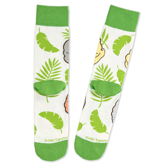 Pair of socks with green leaf patterns on a white background