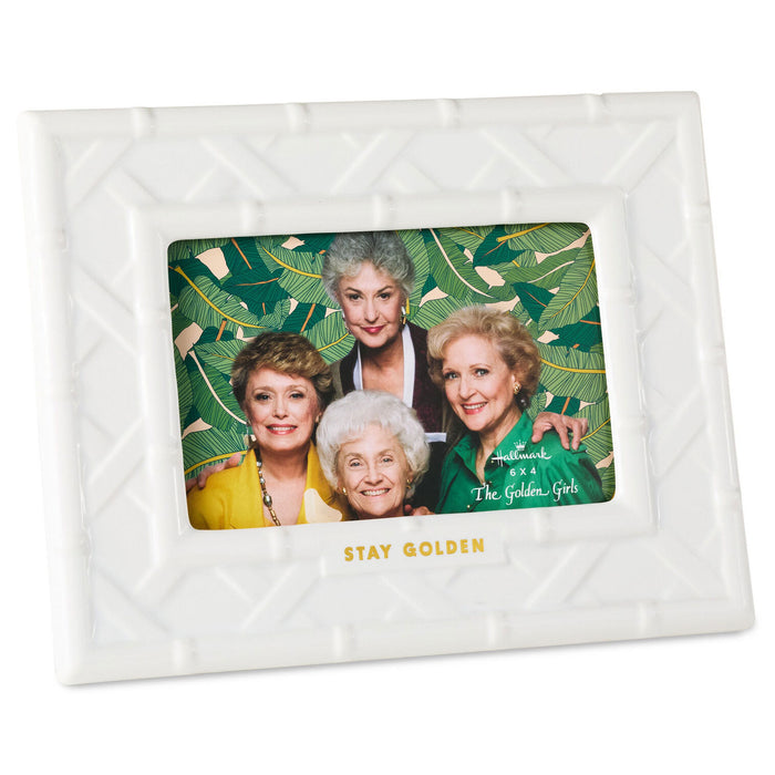 White quilted photo album with 'The Golden Girls' cover featuring four women.
