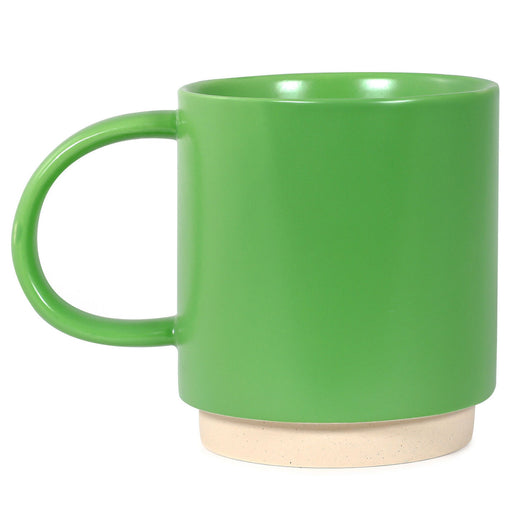 Green mug with a beige base on a white background