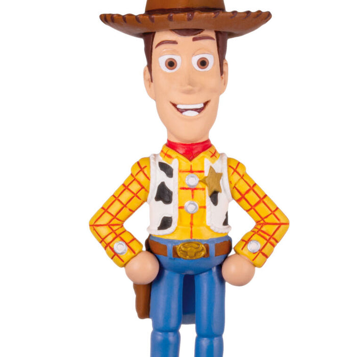 Toy figure of a character in a cowboy outfit with a brown hat on a white background