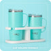 Two turquoise mugs with a white stand on a light blue background, featuring the 'swig' brand.