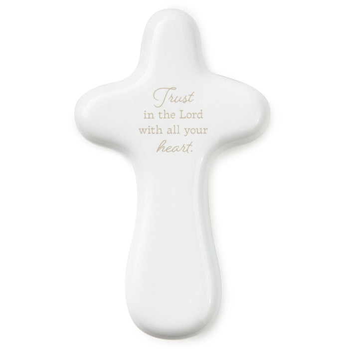 White cross-shaped object with 'Trust in the Lord with all your heart' text on a white background