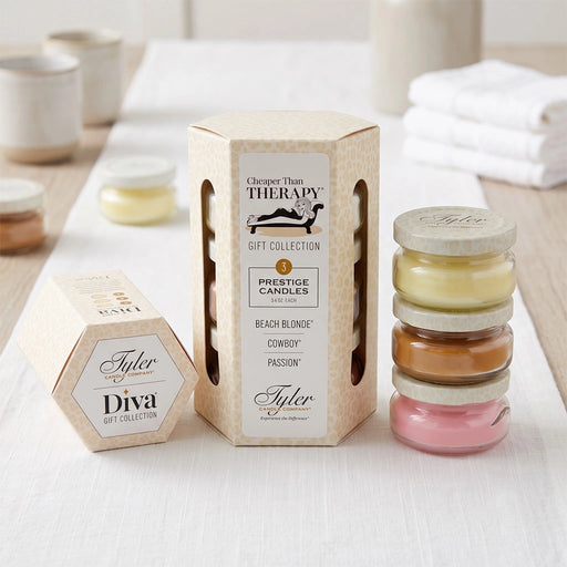 Tyler Cheaper Than Therapy Gift Collection Candle in a clear glass jar with the Cheaper Than Therapy label displayed on a white background.
