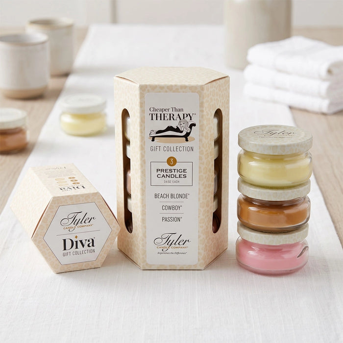 Tyler Cheaper Than Therapy Gift Collection Candle in a clear glass jar with the Cheaper Than Therapy label displayed on a white background.