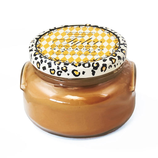 Tyler Cowboy Candle Collection scented candle in a clear glass jar with a Cowboy label and metal lid displayed on a white background.