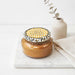 Tyler Cowboy Candle Collection scented candle in a clear glass jar with a Cowboy label and metal lid displayed on a white background.