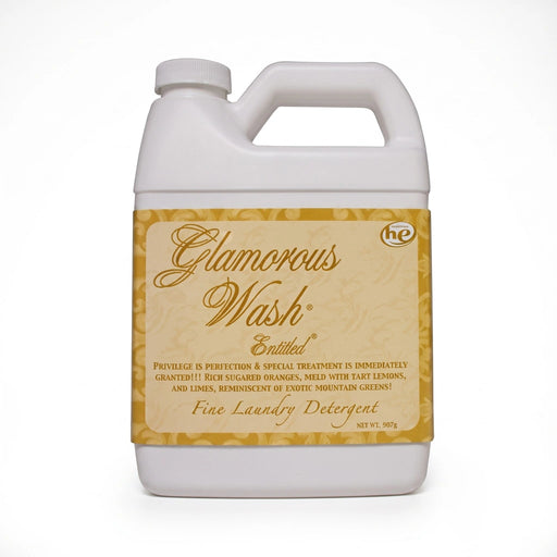 Tyler Entitled Glamorous Wash liquid laundry detergent bottle with the Entitled label displayed on a white background.