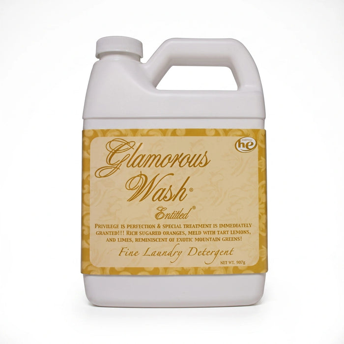 Tyler Entitled Glamorous Wash liquid laundry detergent bottle with the Entitled label displayed on a white background.