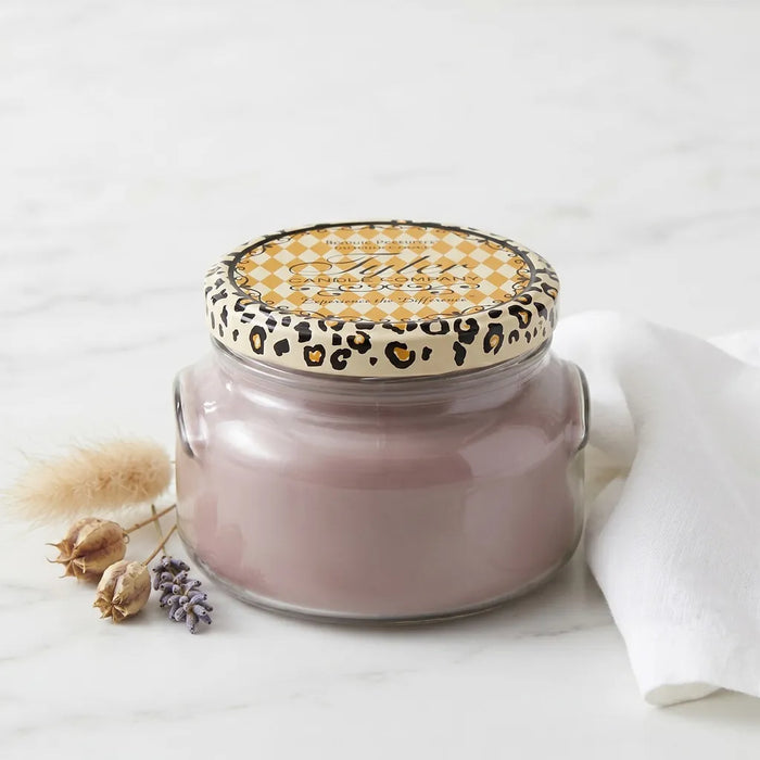 Tyler High Maintenance Candle Collection scented candle in a glass jar with the High Maintenance label displayed on a white background.