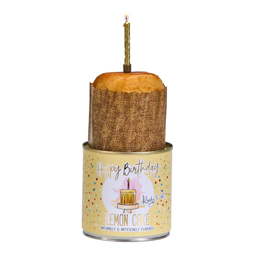 Decorative candle with wooden base and lemon slice on a white background