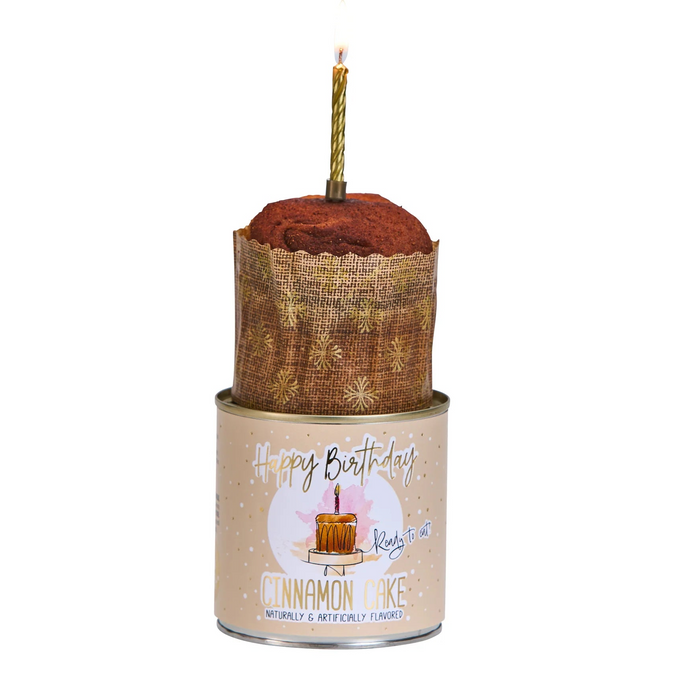 Candle in a decorative holder with a 'Happy Birthday' label on a white background