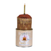 Candle in a decorative holder with a 'Happy Birthday' label on a white background