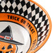 Close-up of a Halloween-themed bowl with a black and white checkered pattern, orange rim, and a jack-o'-lantern wearing a witch hat. The words 'TRICK OR TREAT' are printed around the orange band.