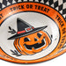 A close-up of a Halloween-themed bowl with an orange rim printed with the words 'TRICK OR TREAT' and a black-and-white check border. The center shows a smiling orange jack-o'-lantern wearing a black witch hat with a red band.