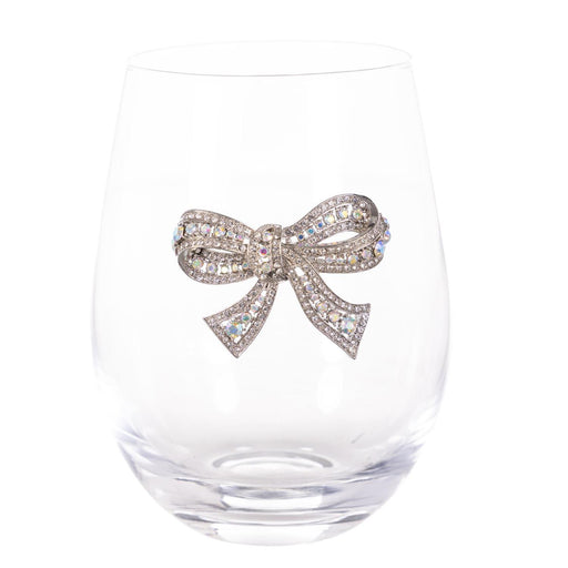 A clear stemless wine glass with a decorative silver bow embellished with sparkling clear rhinestones, shown against a solid white background.