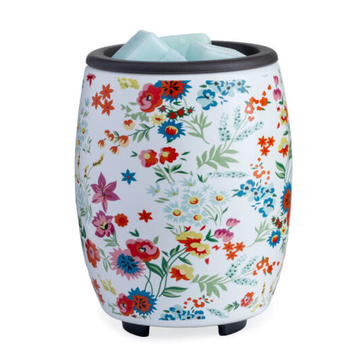 Floral-patterned wax warmer on a white background