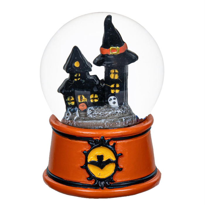 Halloween-themed snow globe with haunted house design on a white background